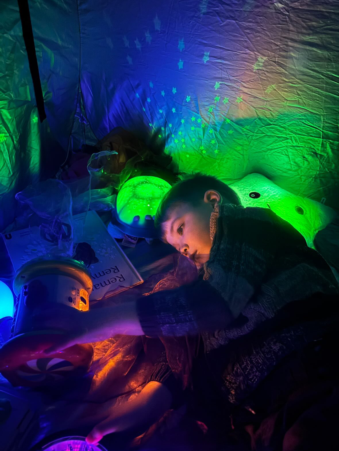 Calm child playing at Fidget and Spin Snuggle and Chill zone