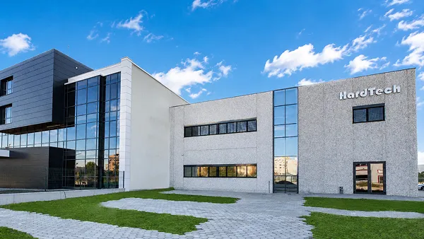 HardTech modern office building with a glass and stone facade.