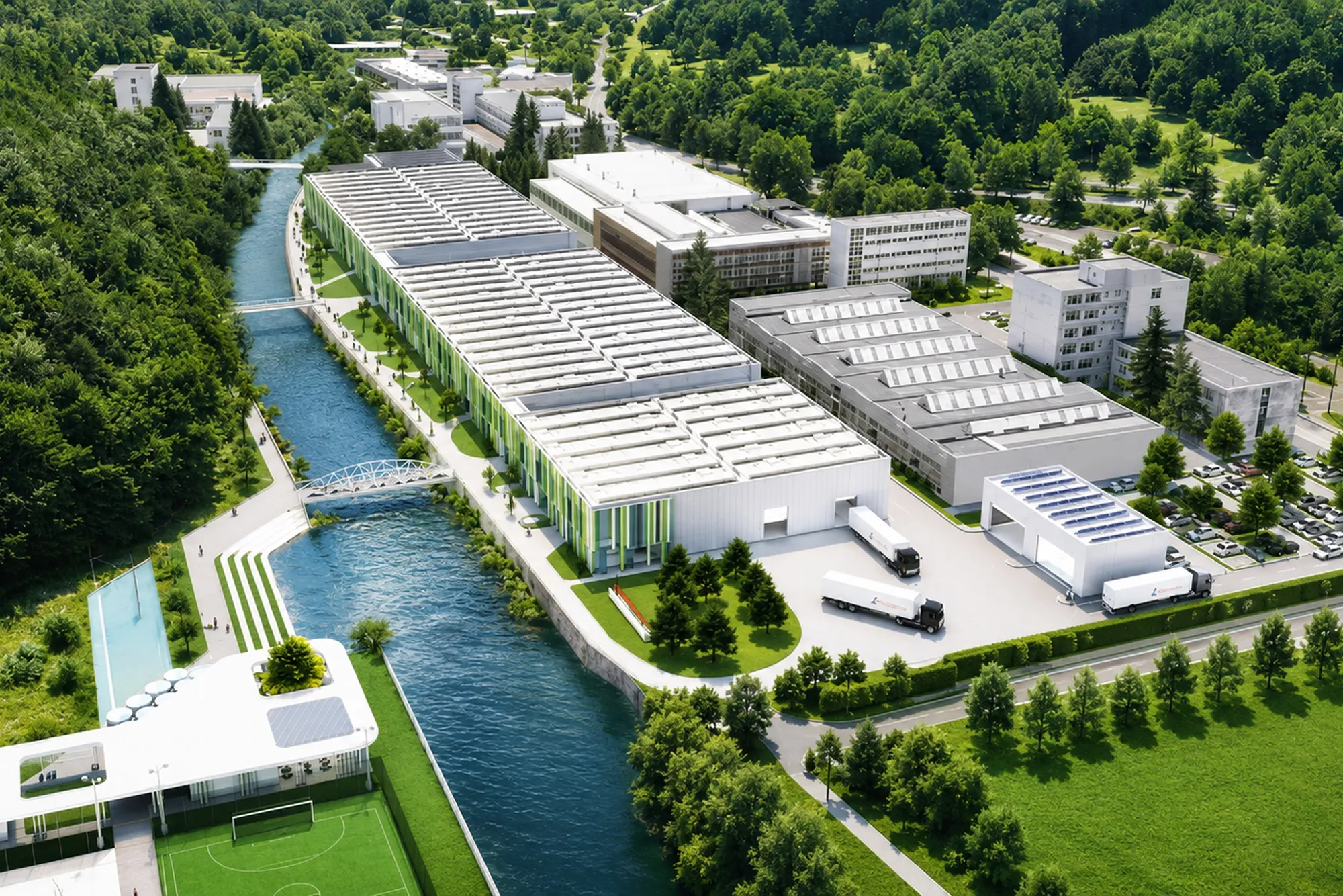 Aerial view of a large industrial manufacturing complex beside a river, surrounded by greenery.
