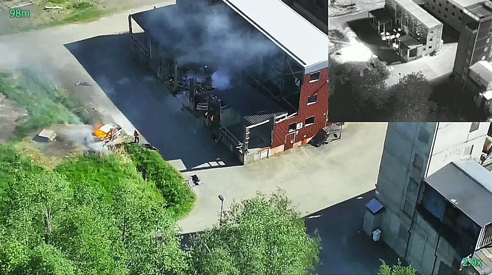 Aerial view of a fire response scenario captured by a drone, with an inset thermal view highlighting heat sources