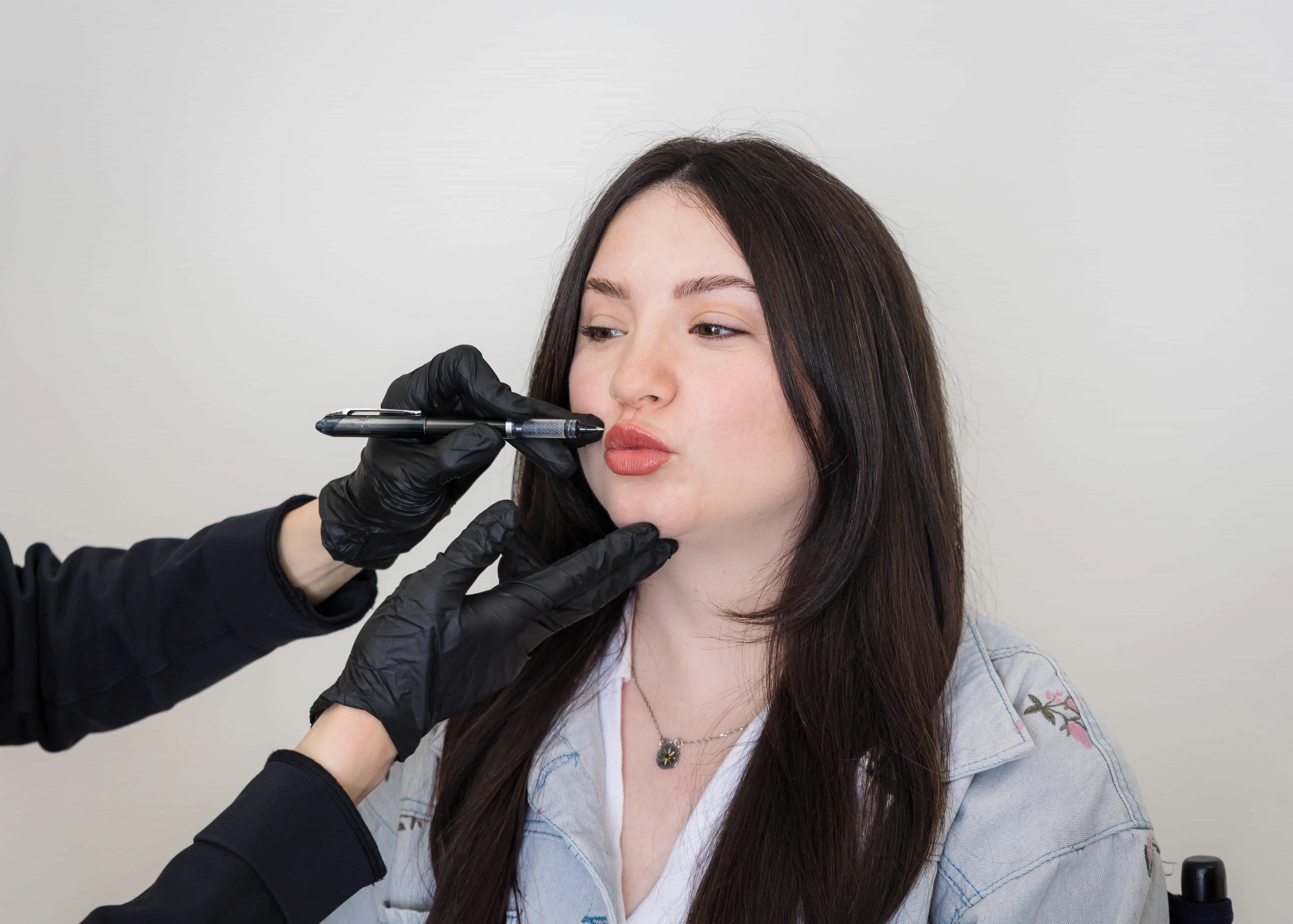 Dr. Chou performing aesthetic injectable procedure on a patient