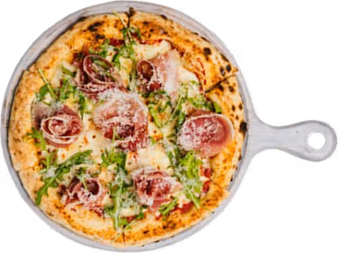 Fresh pizza topped with prosciutto, melted cheese, arugula, and parmesan on a wooden paddle.