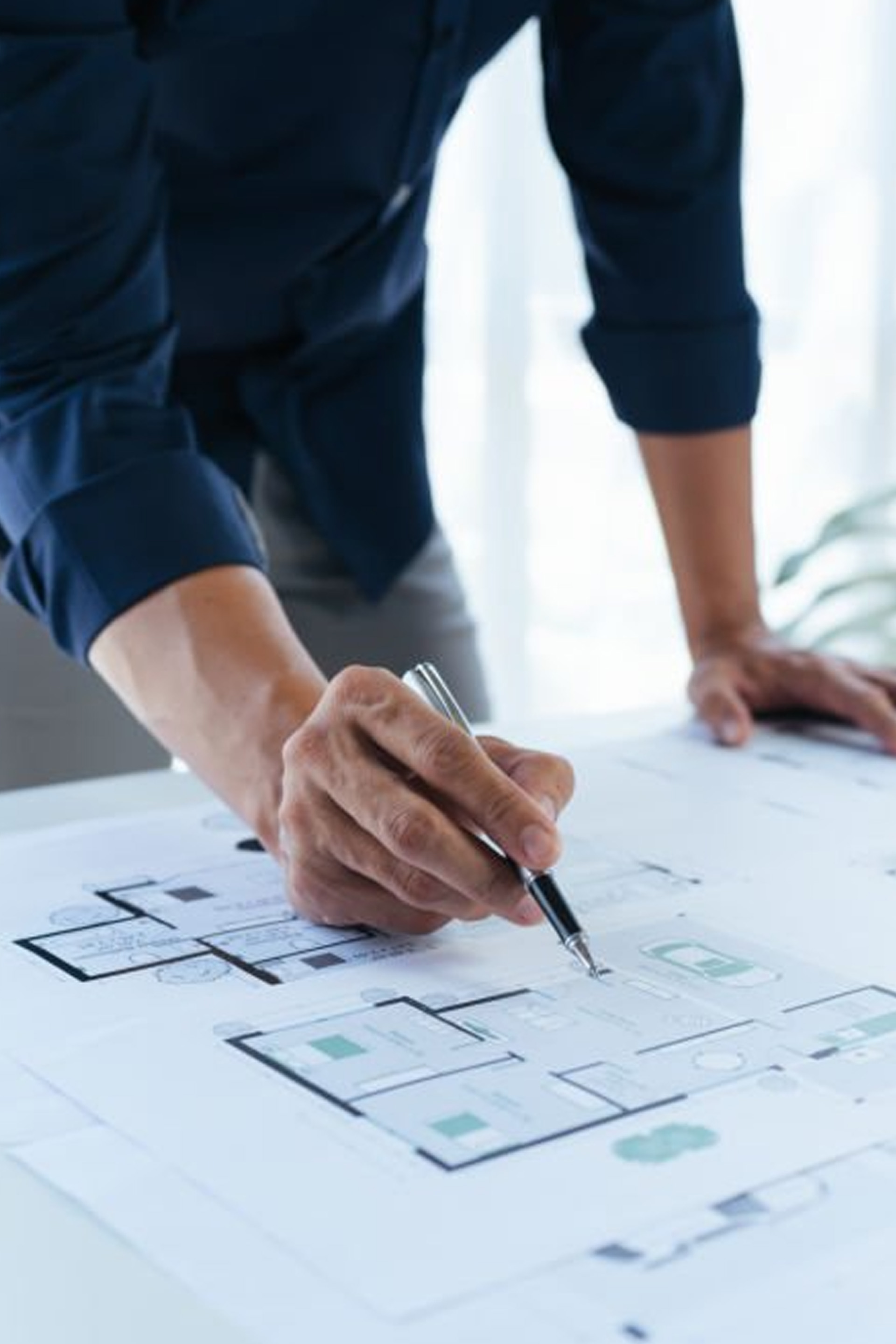 
architect drawing on a plan