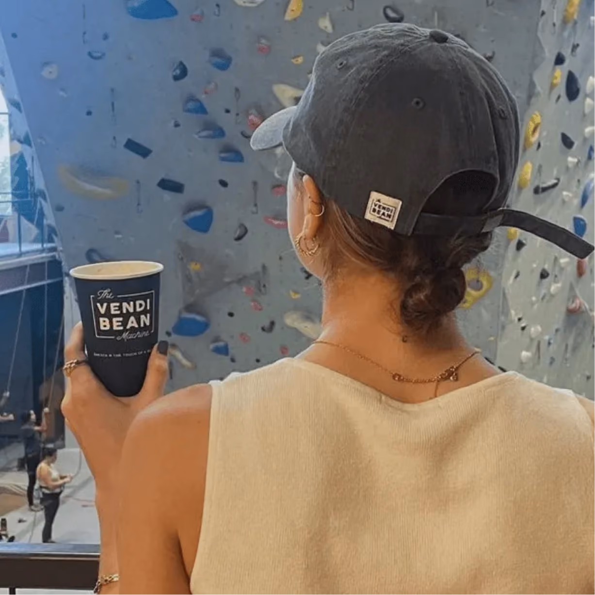 a woman holding a cup