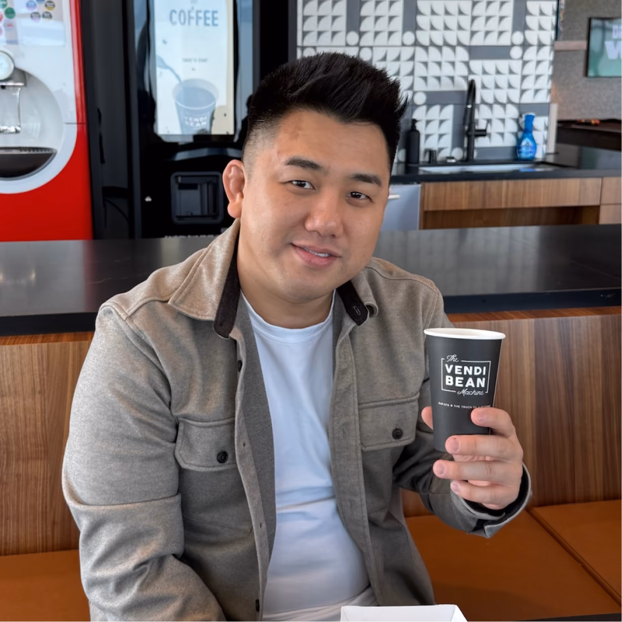a man holding a cup