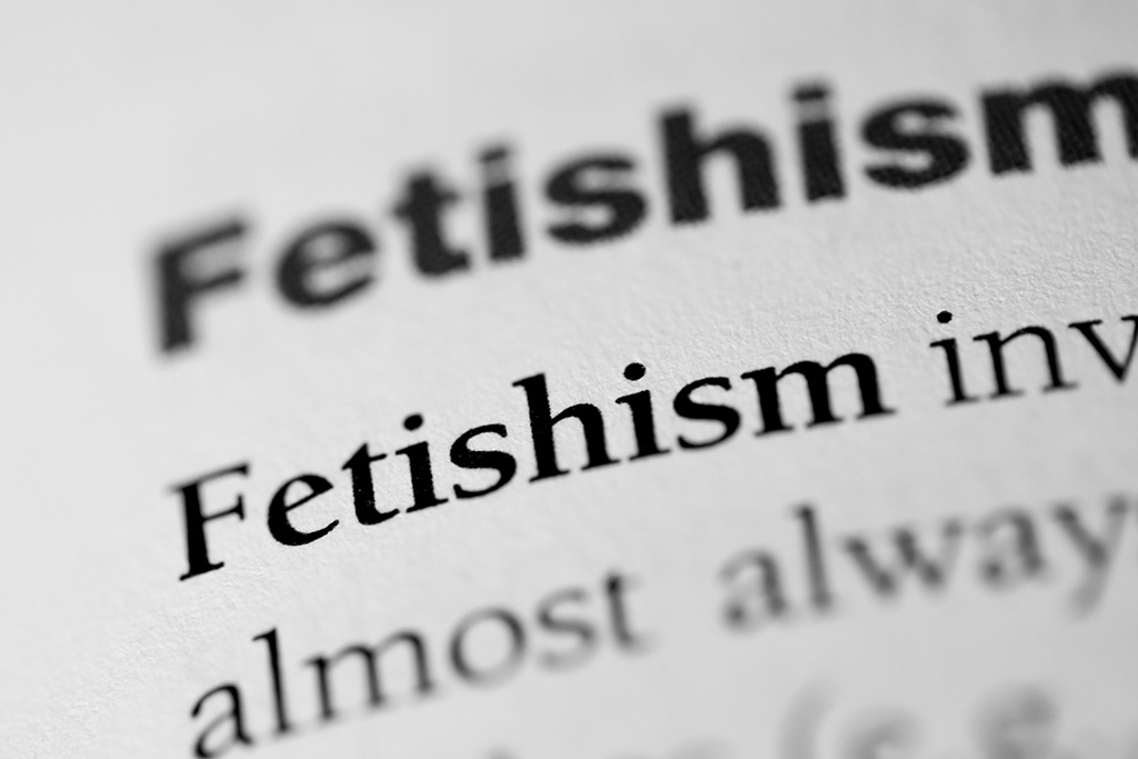 An extreme close-up of a printed dictionary or textbook page showing the entry header and definition for the word "Fetishism".