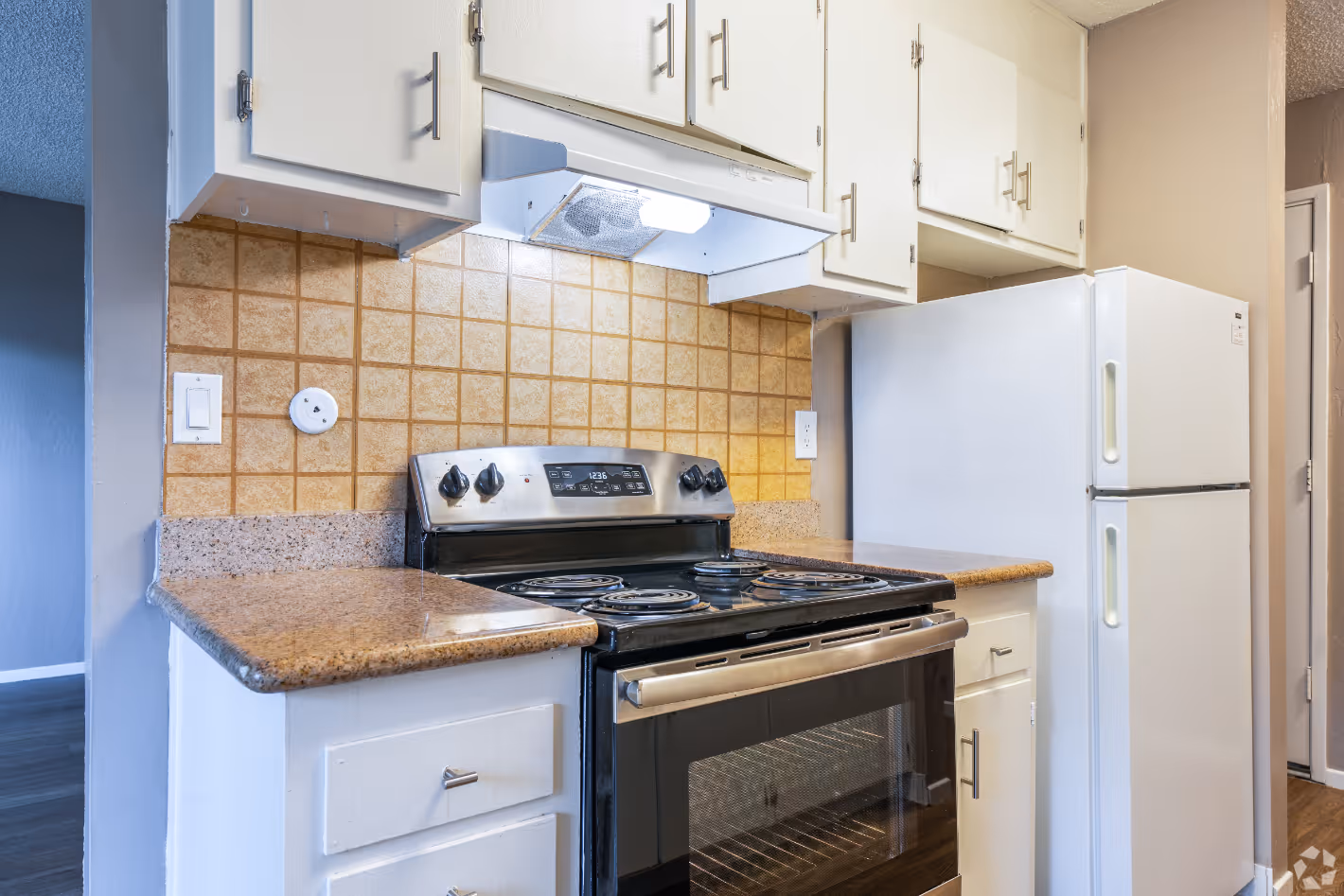 Kitchen with white cabinets and stainless steel appliances