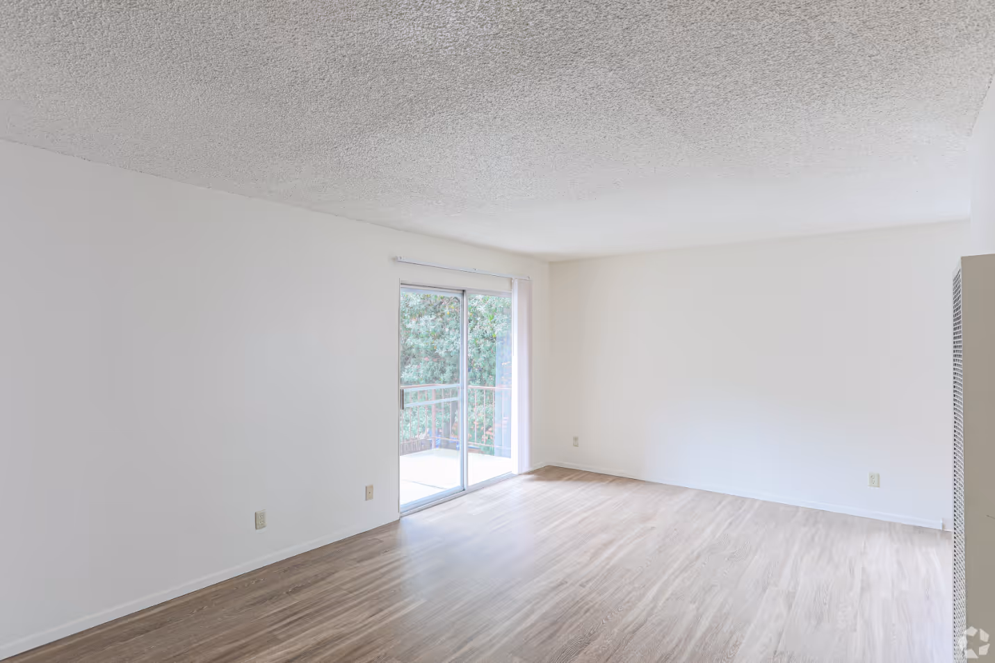 Unfurnished Living area with wood floors
