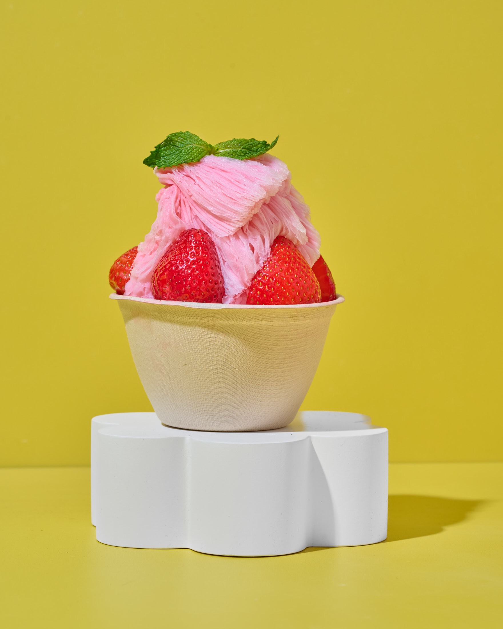 Fresh strawberry bingsu built on shaved milk ice, the Korean alternative to a blended acai bowl