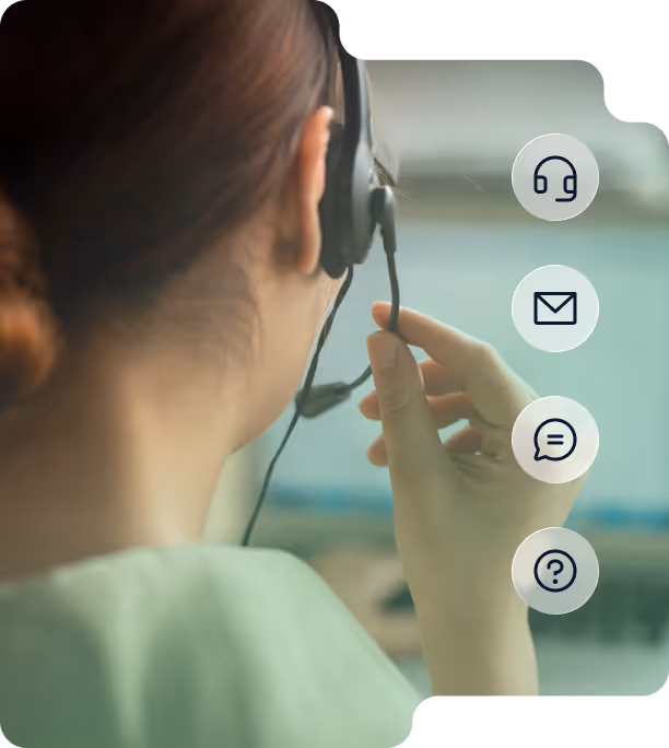 Customer service representative wearing a headset with microphone adjusting it, viewed from behind.