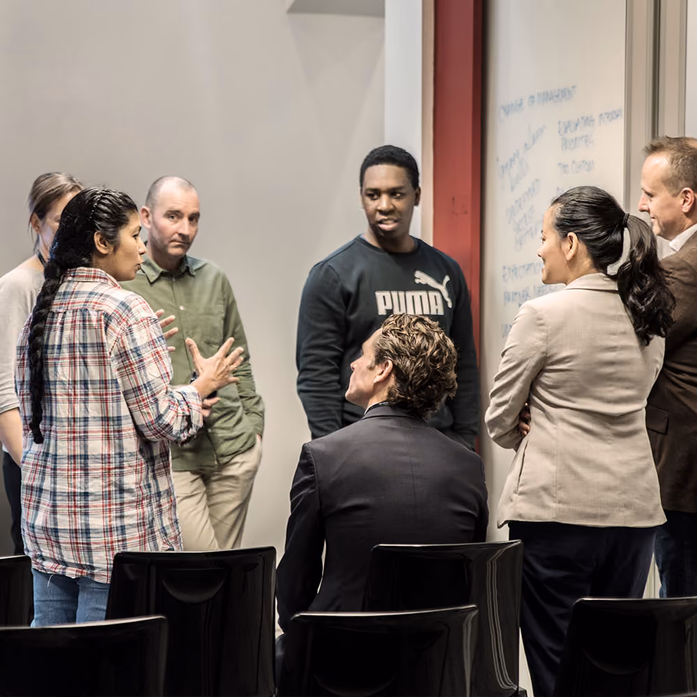 Group of people in a workshop meeting