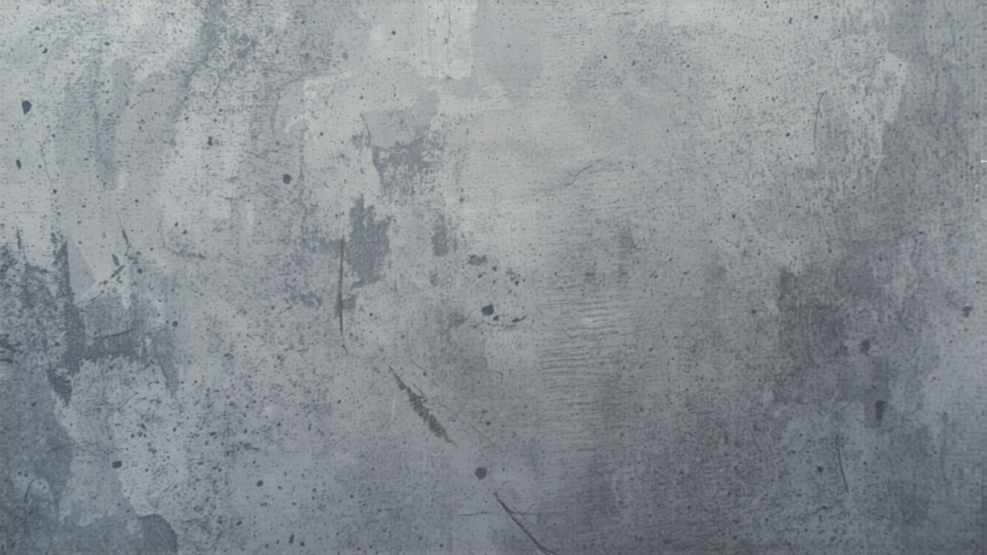 Raw poured concrete surface with subtle tonal variation in cool diffuse light