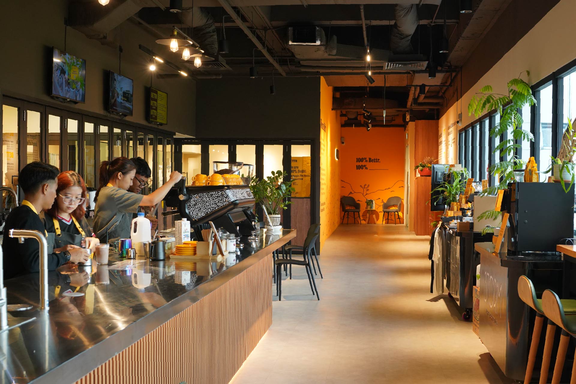 Modern cafe interior with a long coffee bar, bar stools by large windows. 