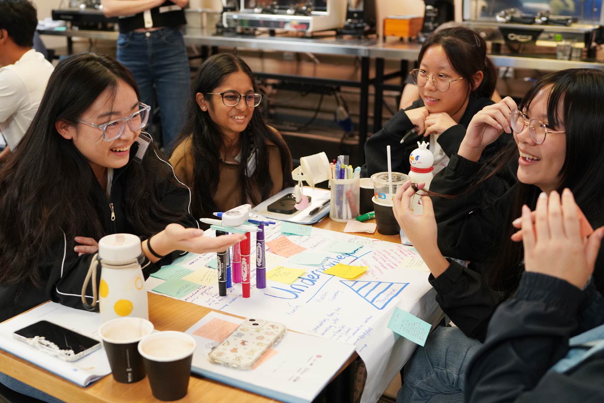 Youth discussing with other participants in her group.