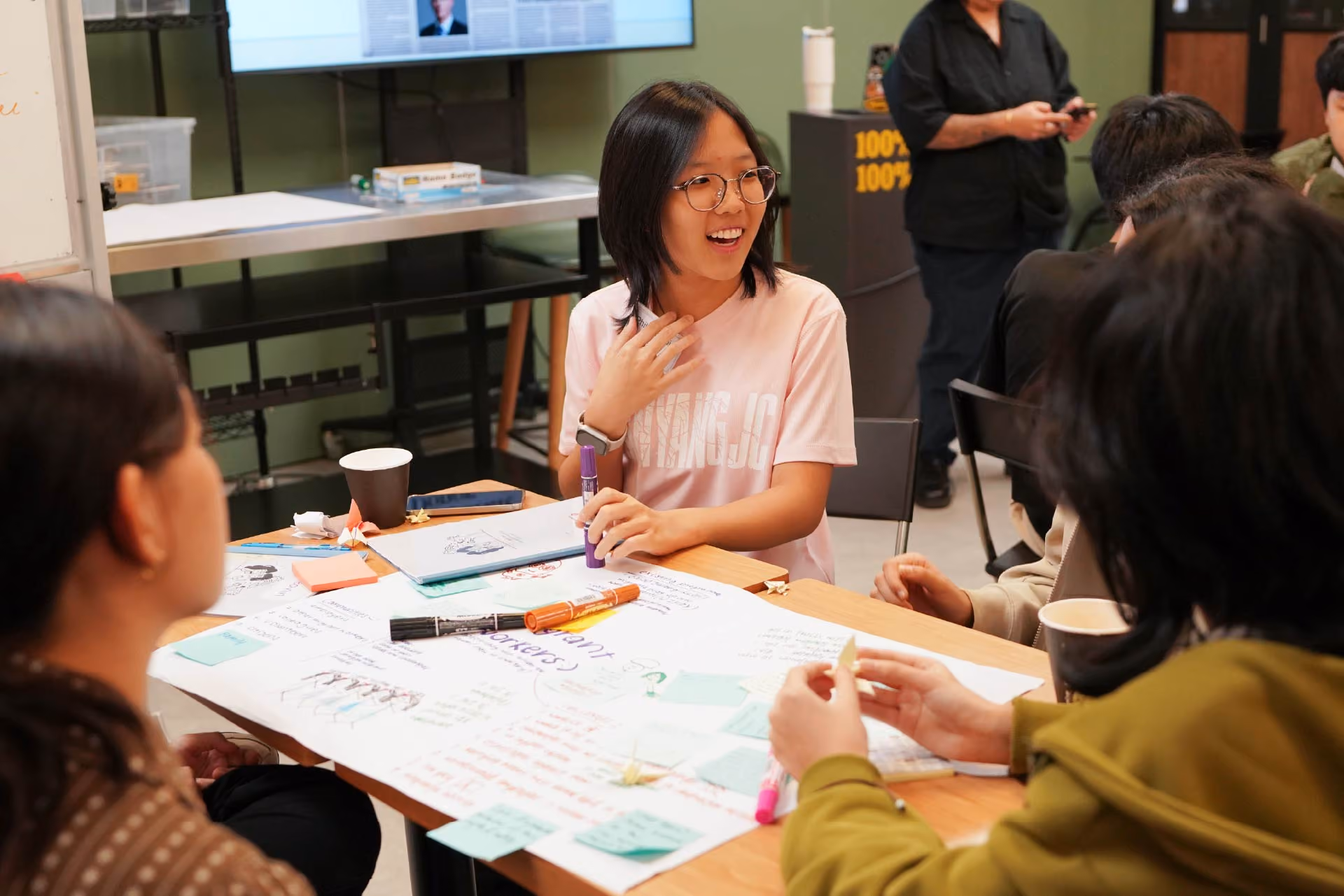 Youth sharing her thoughts with other participants in her group.