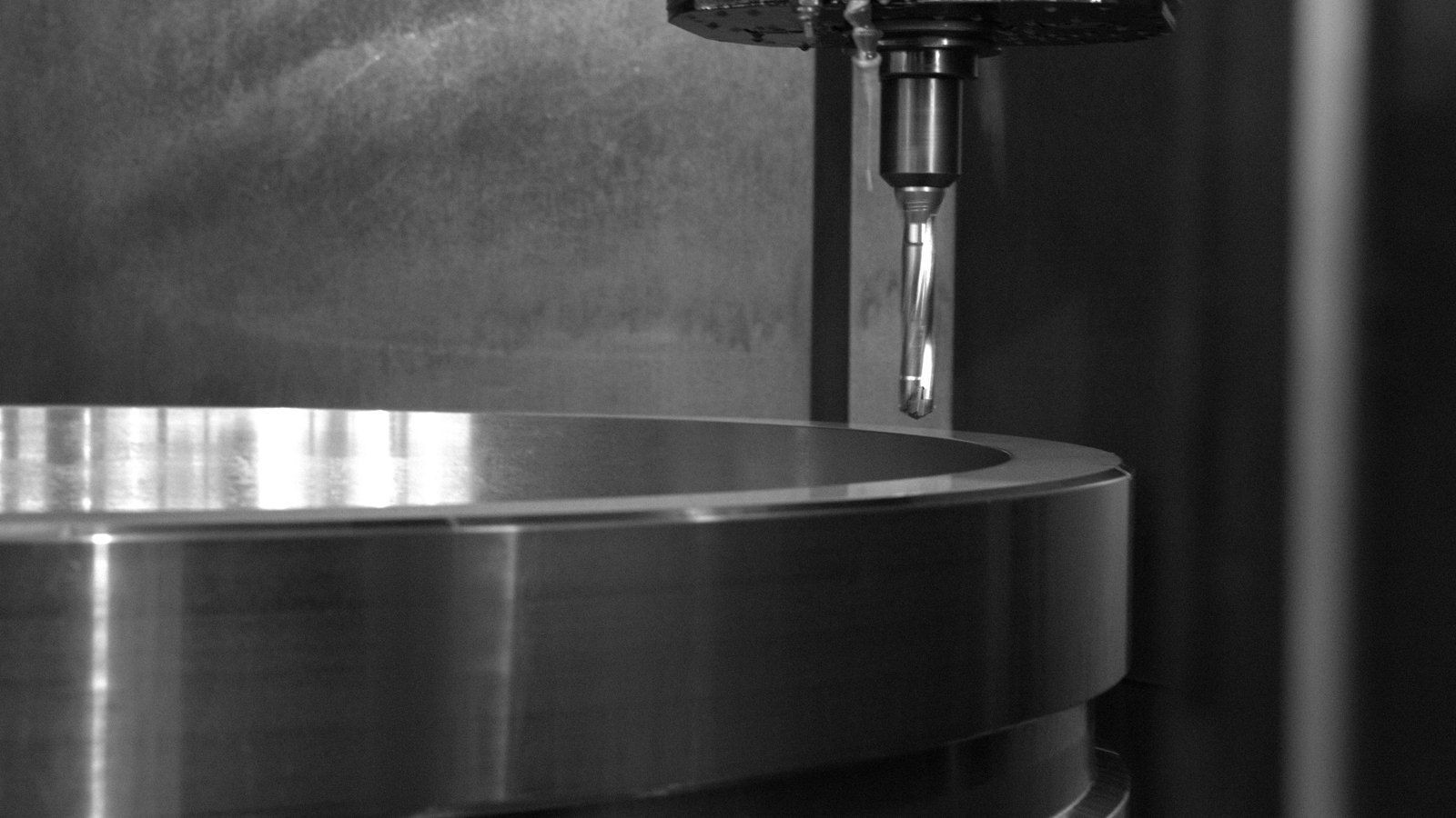 Close-up of precision machined metal ring with finished surfaces