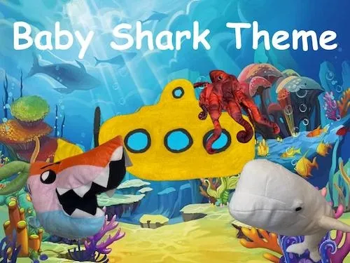 Underwater scene with Baby Shark theme, yellow submarine, and plush shark and whale toys.