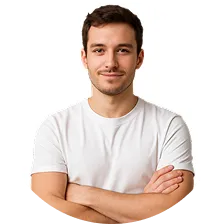 Smiling young man with short dark hair wearing a white t-shirt and arms crossed.