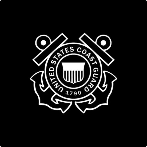United States Coast Guard emblem featuring two crossed anchors behind a circular badge with a shield and the year 1790.