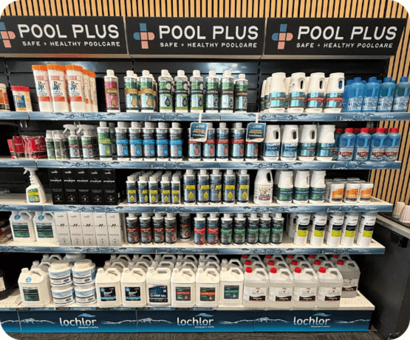Store shelf with Pool Plus pool care products including chemicals and cleaners arranged in rows.