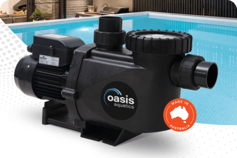 Black Oasis Aquatics pump placed in front of a pool with a Made in Australia badge.