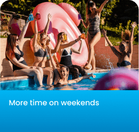 Group of women in swimsuits raising drinks by pool with large pink inflatable flamingo.