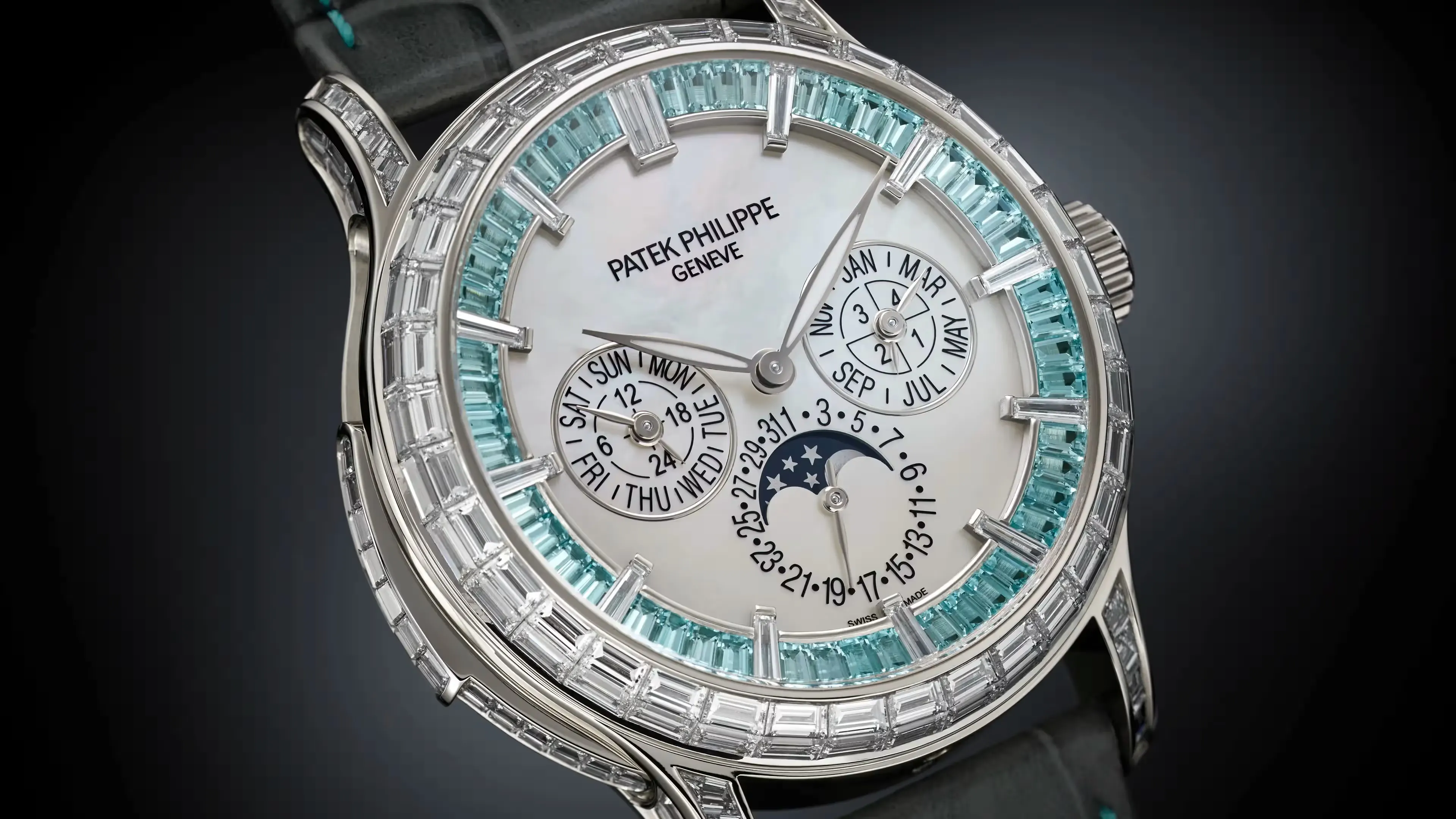 Rose gold wristwatch with a dark blue dial reflecting on a glossy surface.