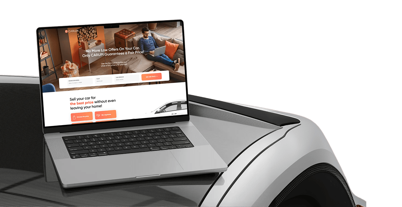 Laptop showing Carupi website on glossy silver car hood with black and white trim.