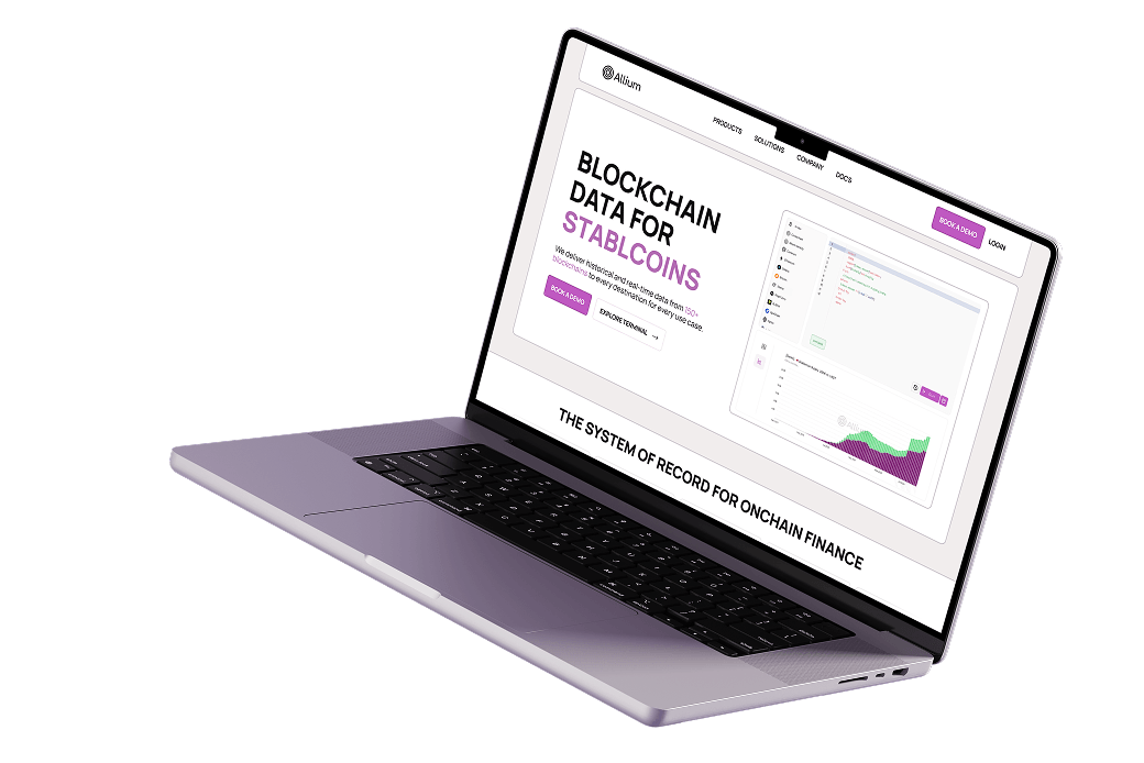 Laptop showing Allium website with blockchain data for stablecoins and onchain finance analytics.