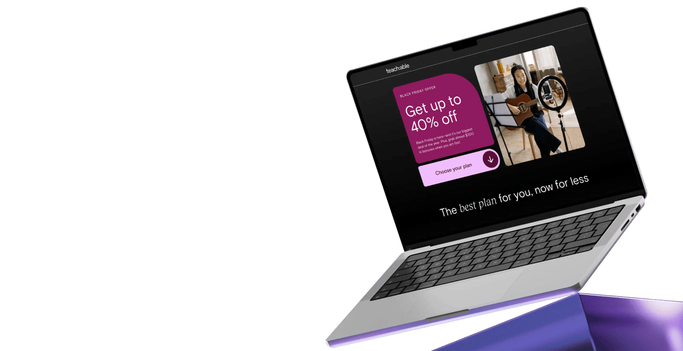 Laptop showing a Black Friday offer for up to 40% off and a woman playing guitar in a video.
