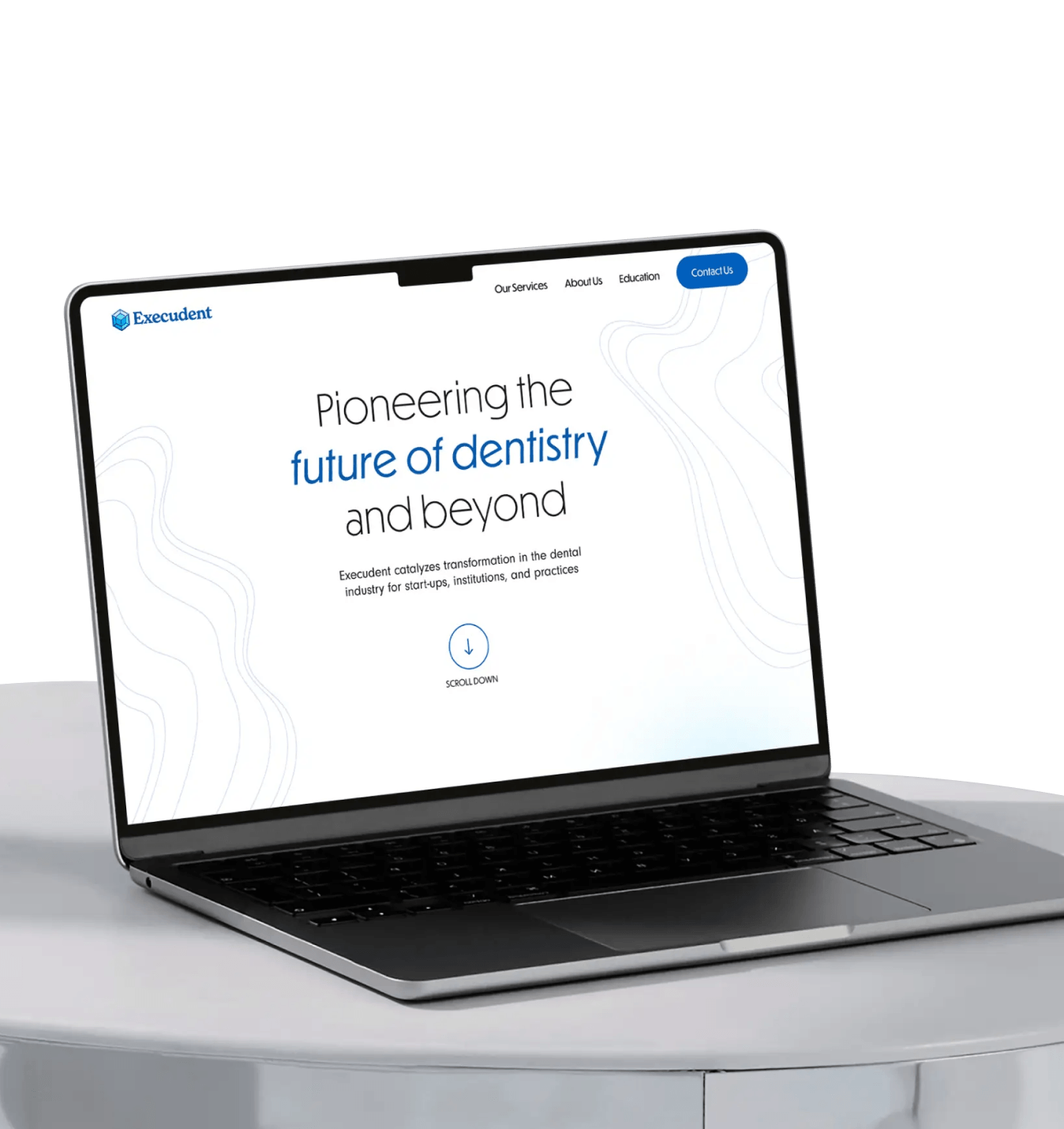 Open laptop on white table showing Execudent website with text about pioneering future of dentistry.
