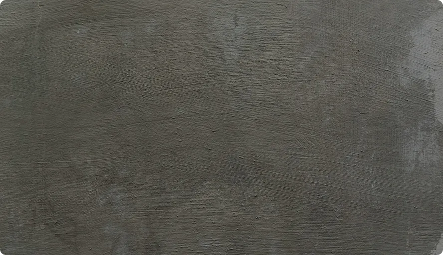 Oberfläche aus geglättetem Beton mit leichter Struktur und grauer Farbe.