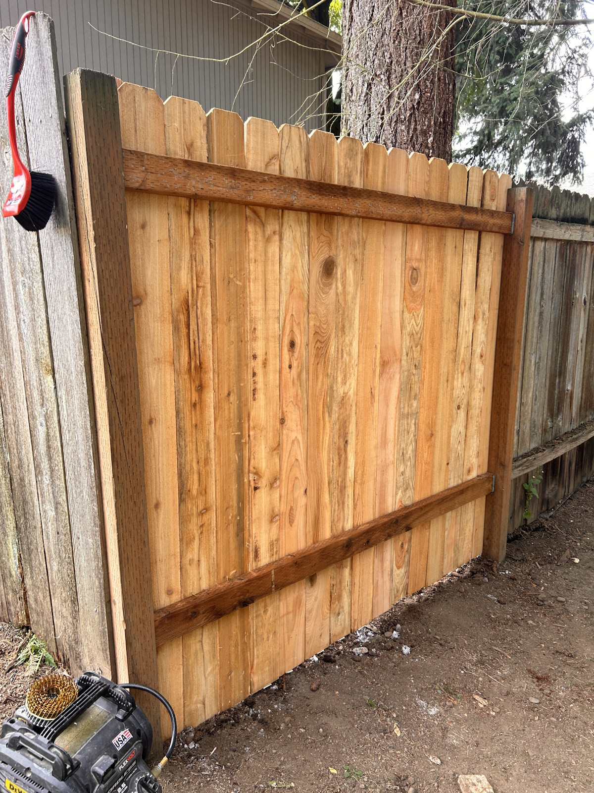 Fence repair with new rails and boards using existing posts and hangers.