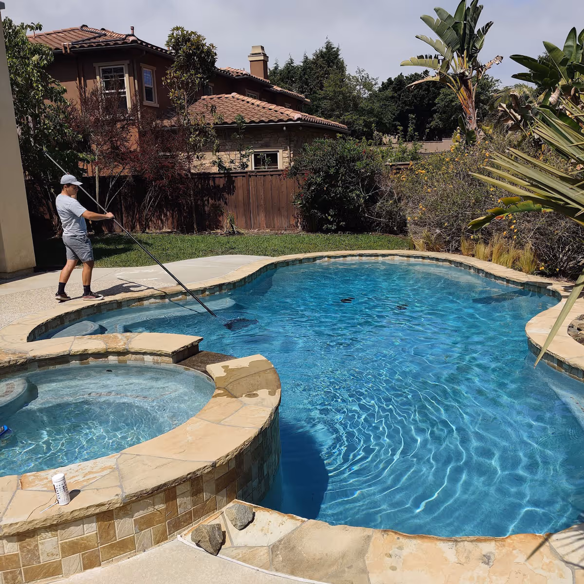 Pool service in progress for a Carlsbad swimming pool.