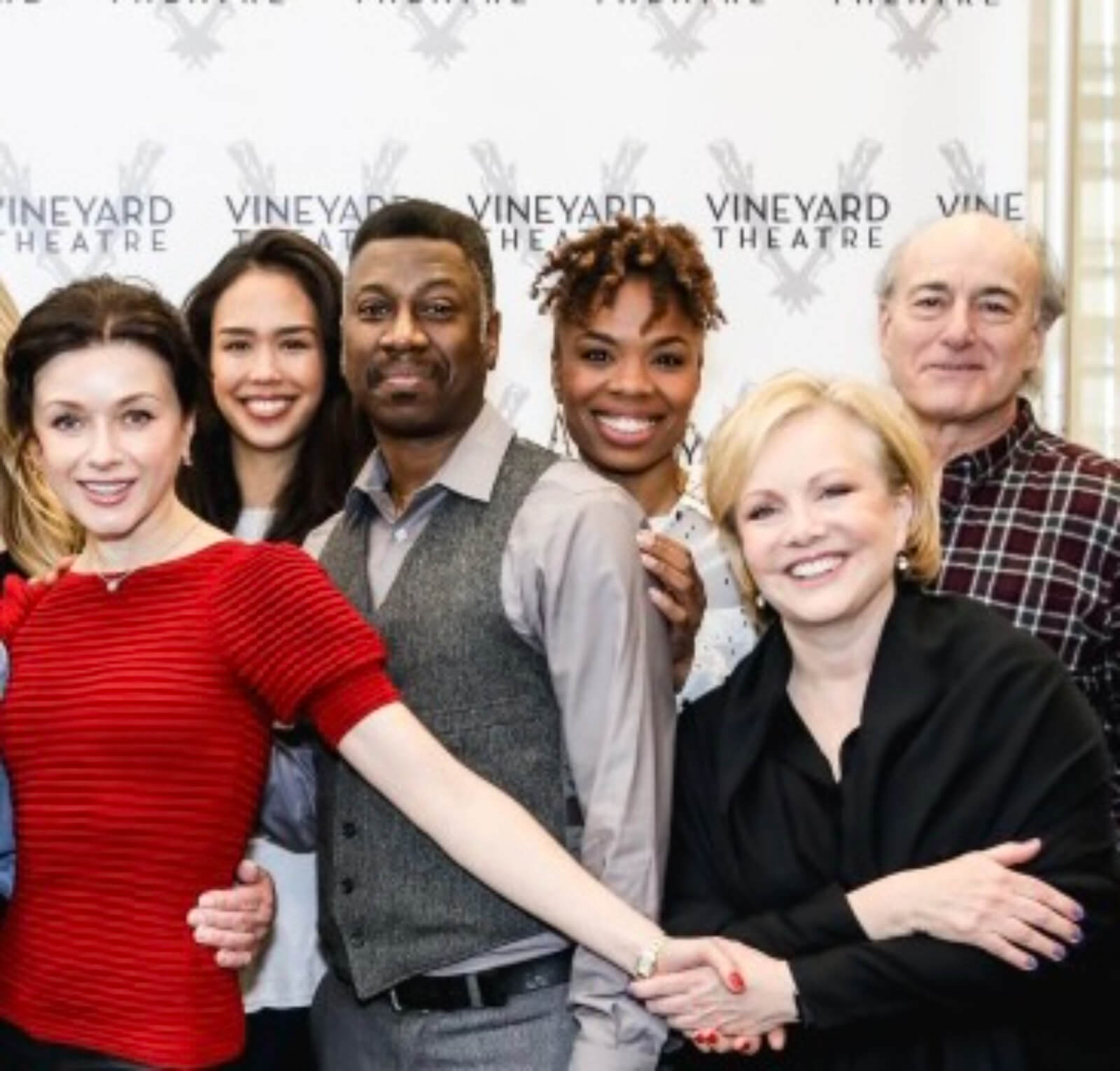 Irina Dvorovenko, Maira Barriga, Teagle F. Bougere, Erin N. Moore, Susan Stroman, and Peter Friedman in front of a step-and-repeat with Vineyard Theatre's logo.