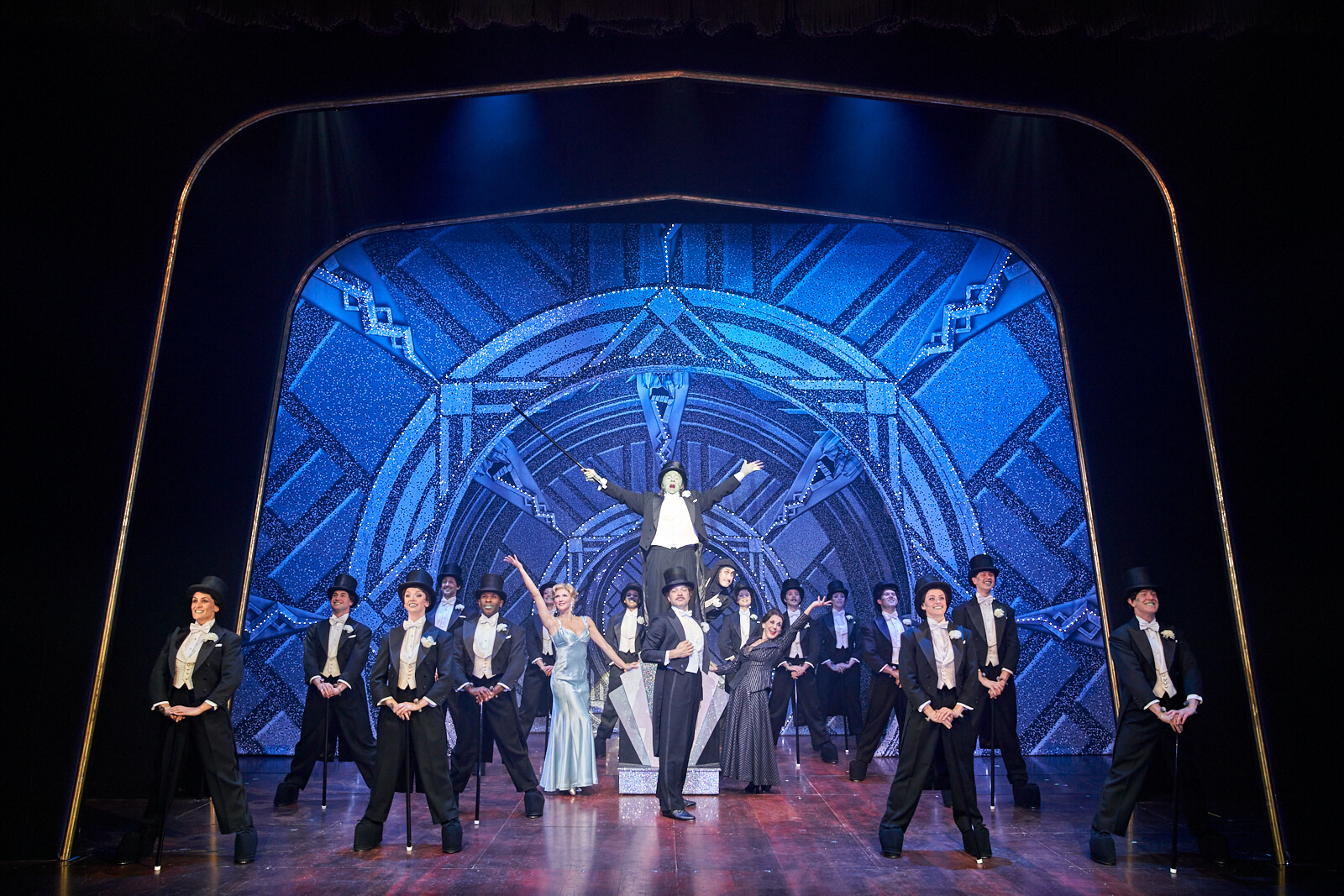 The Monster (Nic Greenshields) standing on a pedestal, hits a full picture pose of "Puttin on the Ritz" with Inga, Dr. Frankenstein, Igor, Frau Blucher and the ensemble.