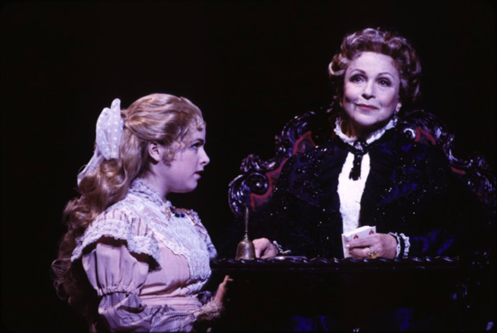 Anna Kendrick as Fredrika and Claire Bloom as Madame Armfeldt. Fredrika is in deep conversation with her Grandmother as she plays solitaire. 