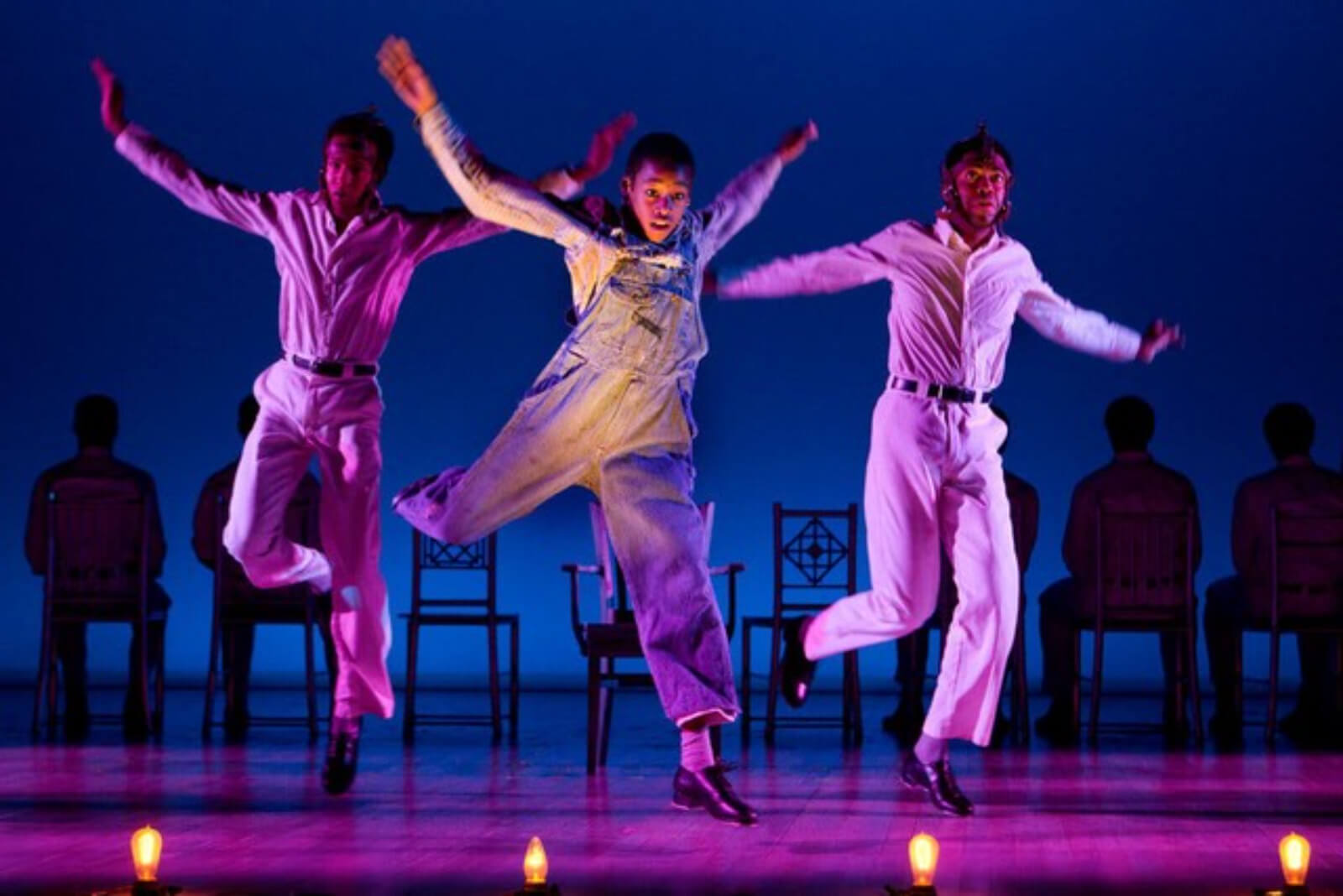 Willie Roberson (Kendrick Jones), Eugene Willams (Jeremy Gumbs), and Roy Wright (Julias Thomas III) tap dance to "The Electric Chair". They are bathed in purple light doing fancy tap steps.