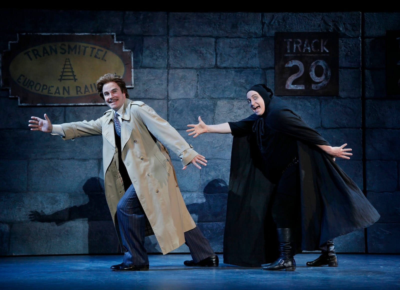 Dr. Frankenstein (Roger Bart) dances with Igor (Cory English) to the song "Together Again". They are at the Transylvania Train Station.