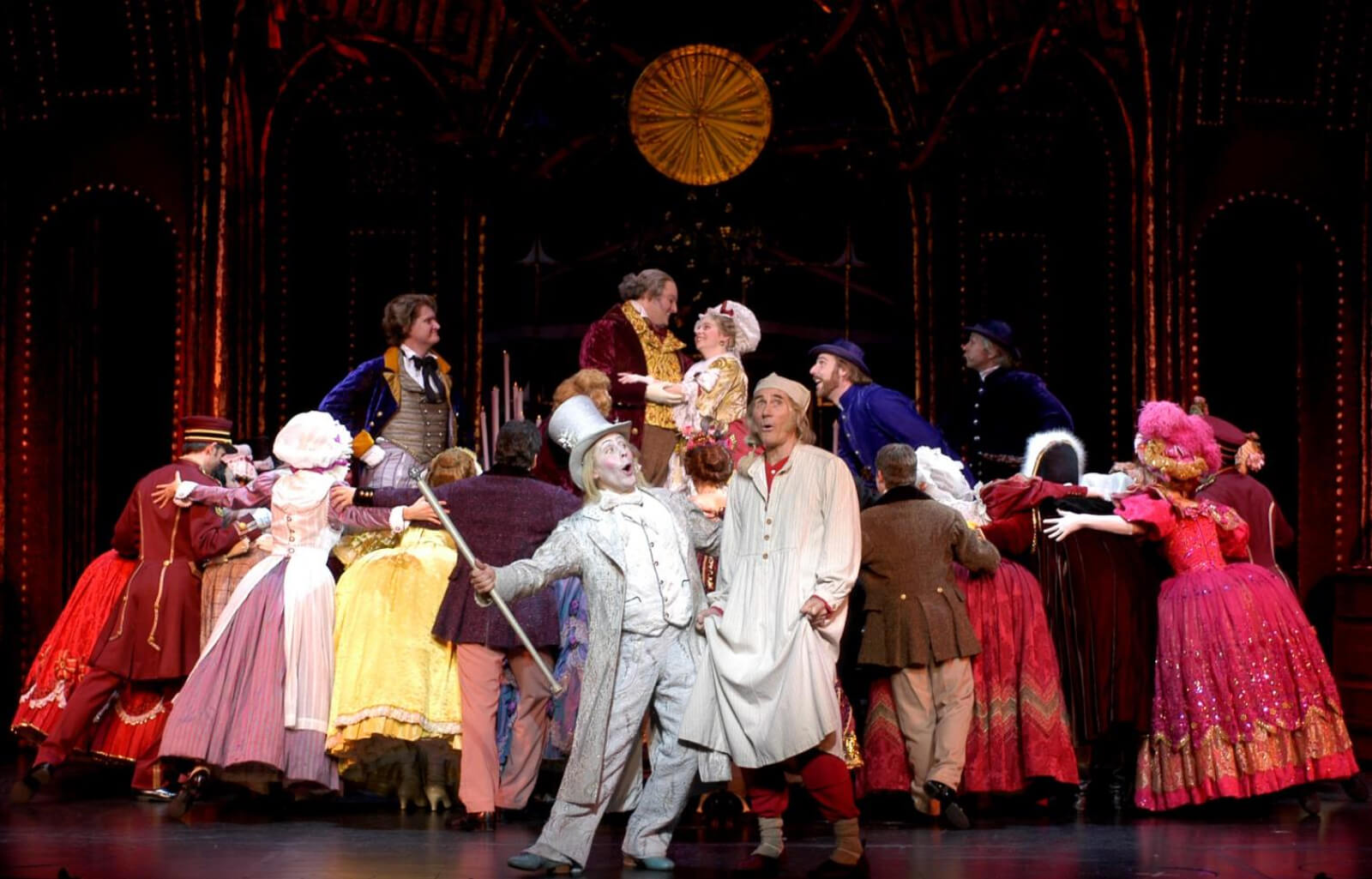 The Ghost of Christmas Past (Justin Brill) and Scrooge (Jim Dale) at Fezziwig's Ball.