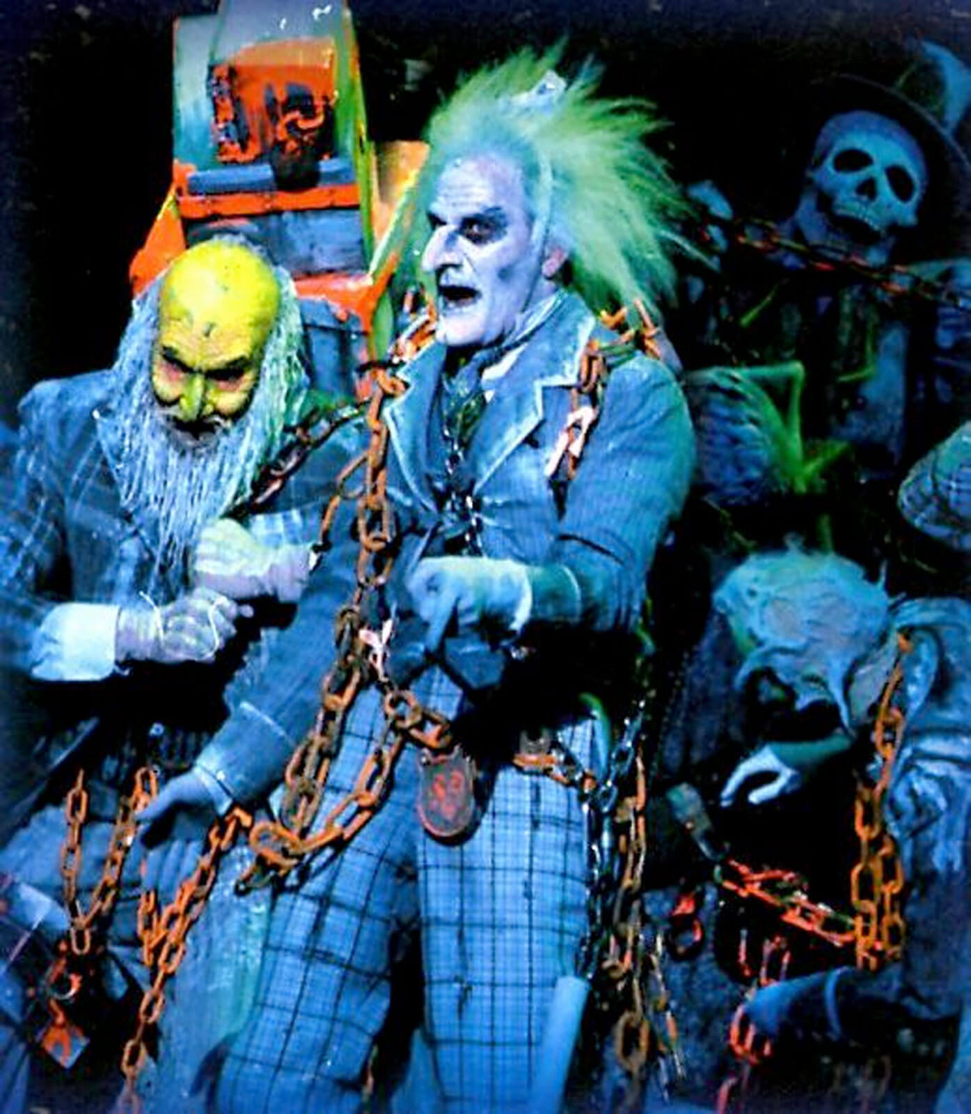 The Ghost of Jacob Marley (Paul Kandel) surrounded by spirits.