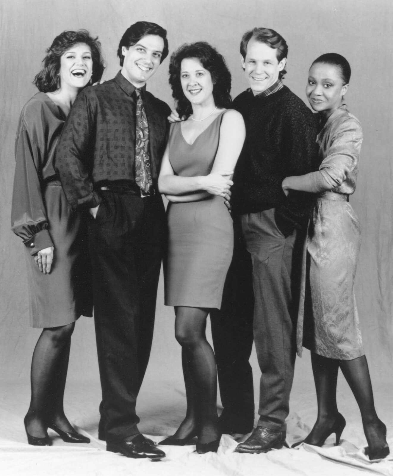 A black and white press photo of the full cast
