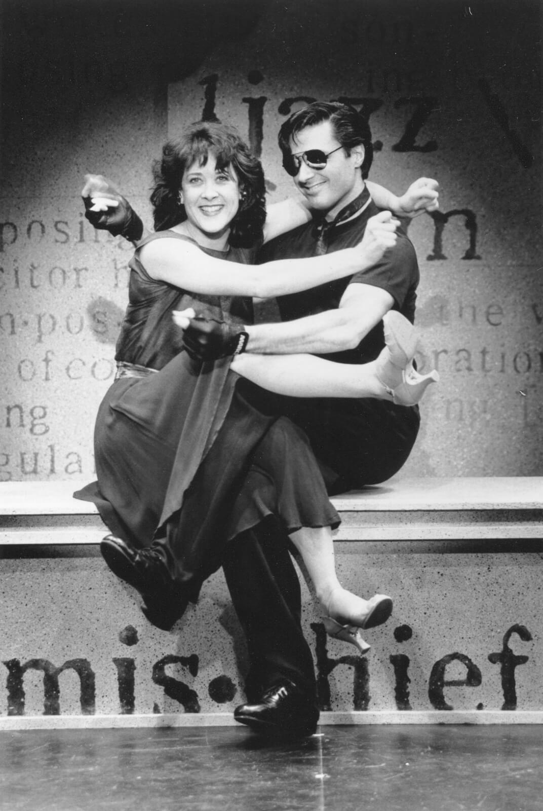 Karen Ziemba and Robert Cuccioli performing "Arthur in the Afternoon". They are sitting in a hugging position.
