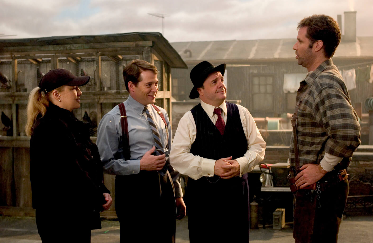 Susan Stroman with Nathan Lane as Max Bialystock, Matthew Broderick as Leo Bloom, and Will Ferrell as Franz Liebkind during rehearsal. They are in front of a pigeon coop on a rooftop.