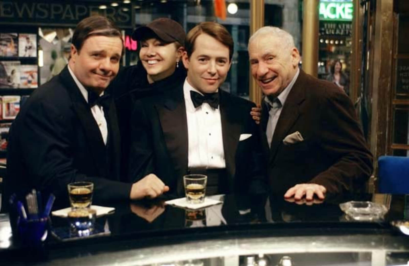 Susan Stroman with Nathan Lane as Max Bialystock, Matthew Broderick as Leo Bloom, and Mel Brooks during rehearsal. They are on the stage set of Sardis. 