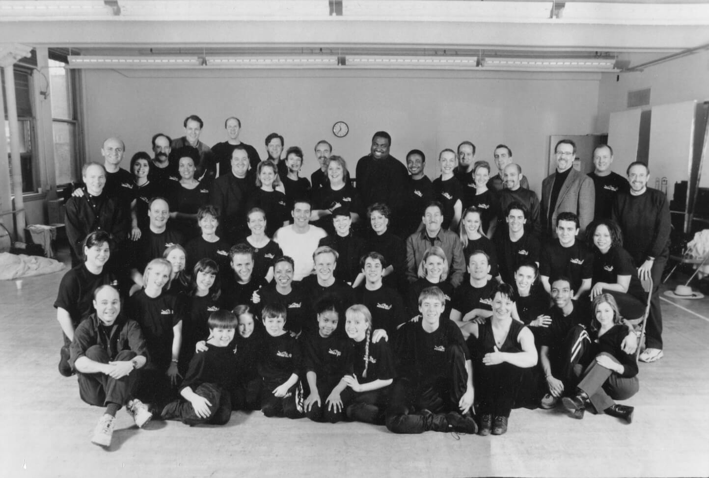 Susan Stroman with the full cast and creative team of The Music Man in a black and white photo.
