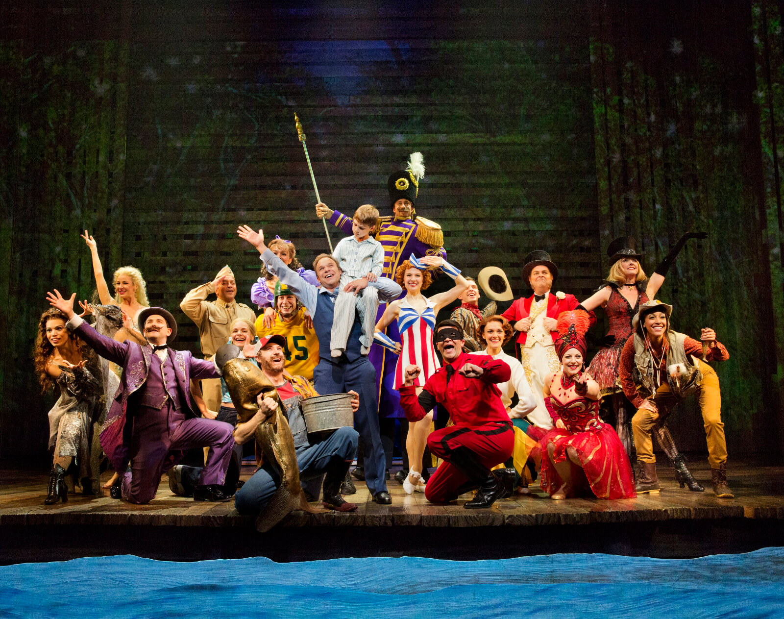 The cast in "Be the Hero". They are dressed in various characters representing Edward Bloom's entire life. 