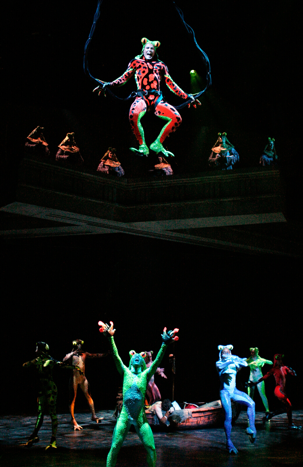 Fire Belly bouncing frogs in the production number ”The Frogs”.