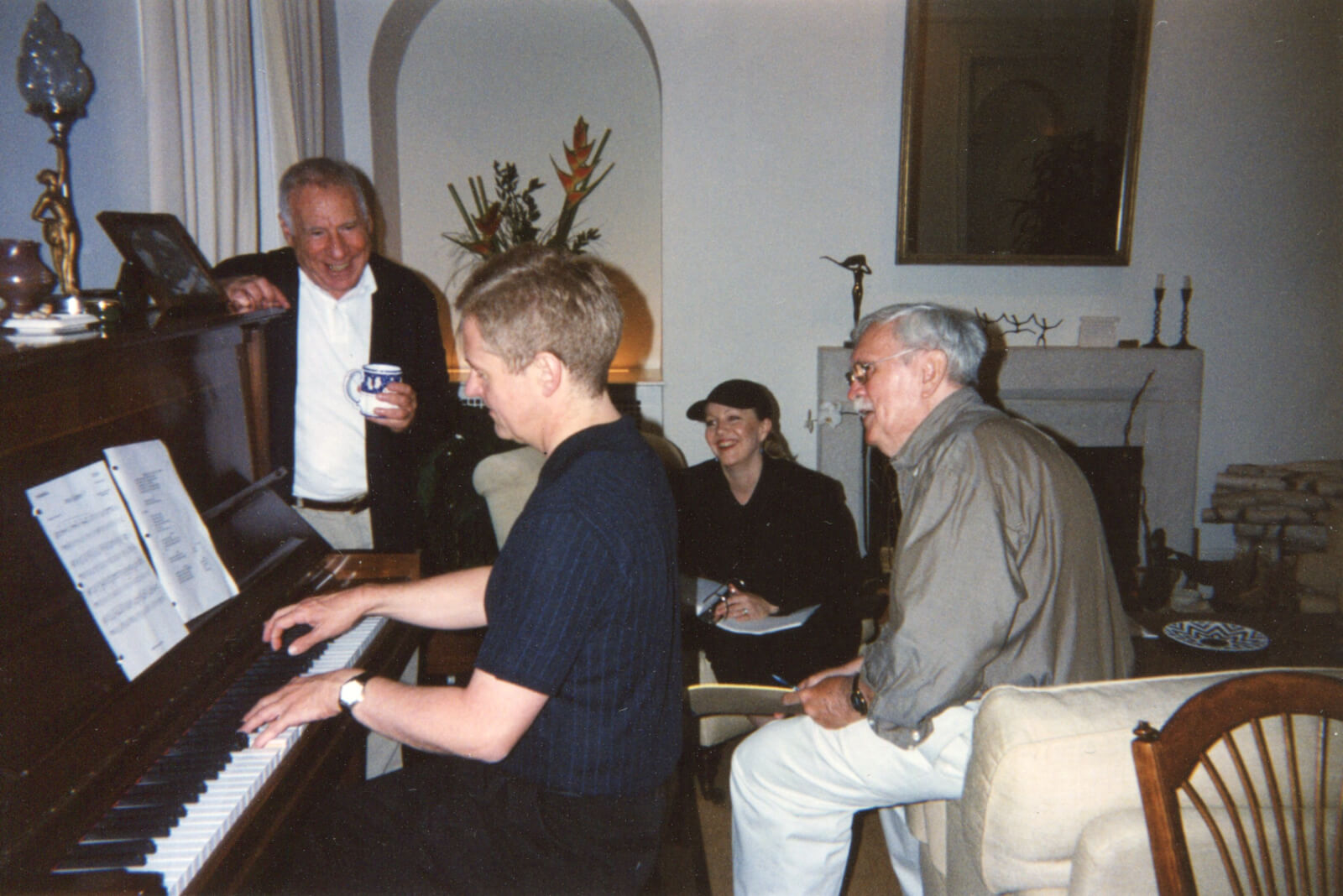 Glen Kelly at the piano, working on the show with Mel Brooks, Susan Stroman, and Thomas Meehan.