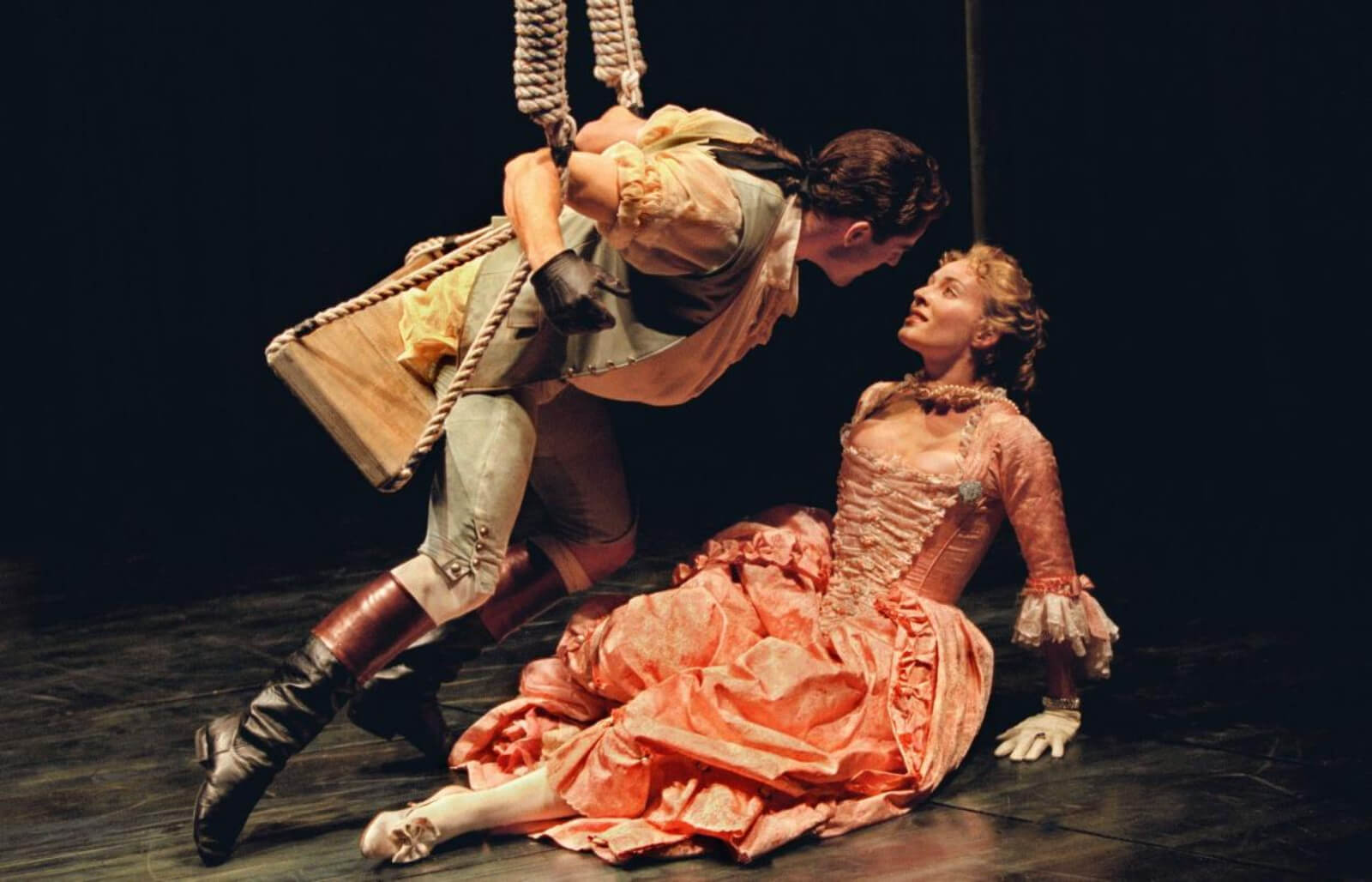 Seán Martin Hingston and Stephanie Michels in "Swinging" from Contact. He is leaning in for a kiss, she is on the ground. They are both dressed in costumes from the famous Fragonard Painting The Swing.